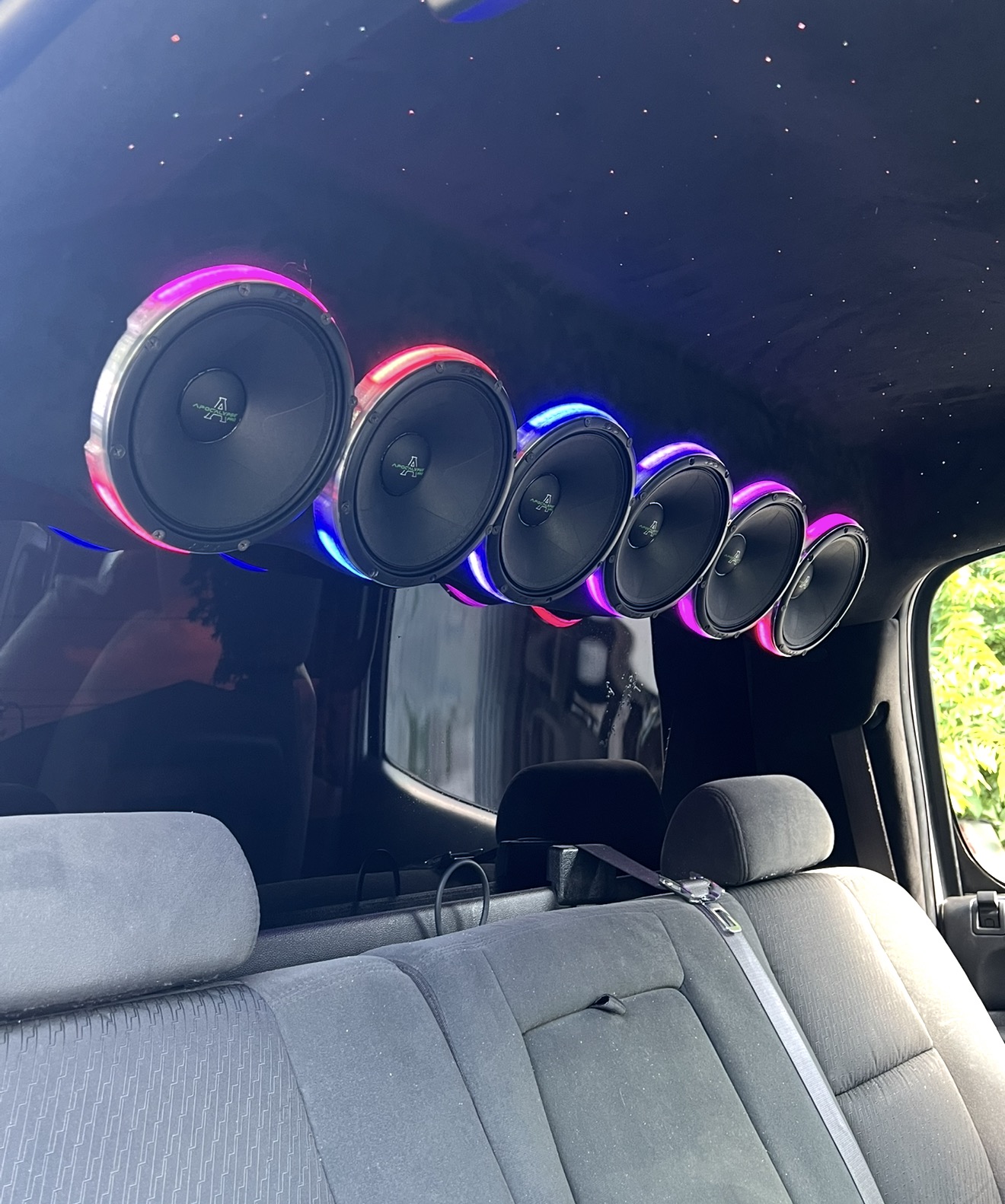 Custom car interior with RGB speaker rings and starlight headliner