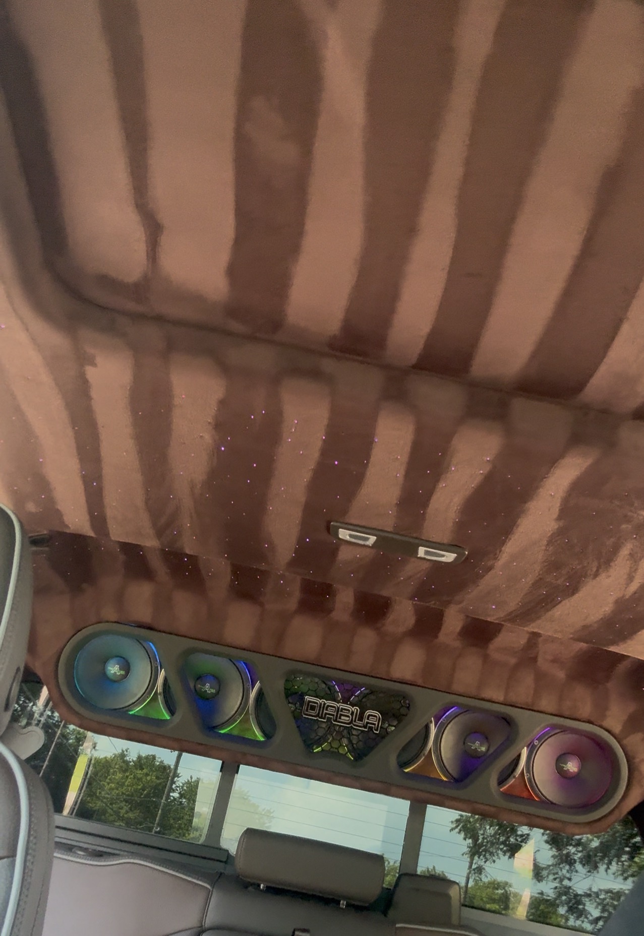 Finished suede headliner with starlight and RGB-lit DIABLA speaker bar